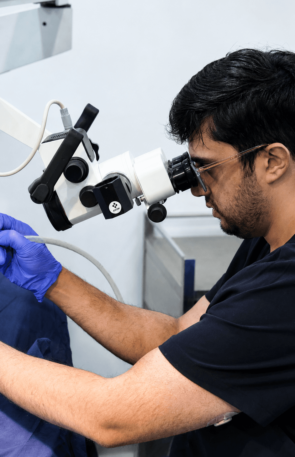 Dr Ali Gilani performing ear microsuction